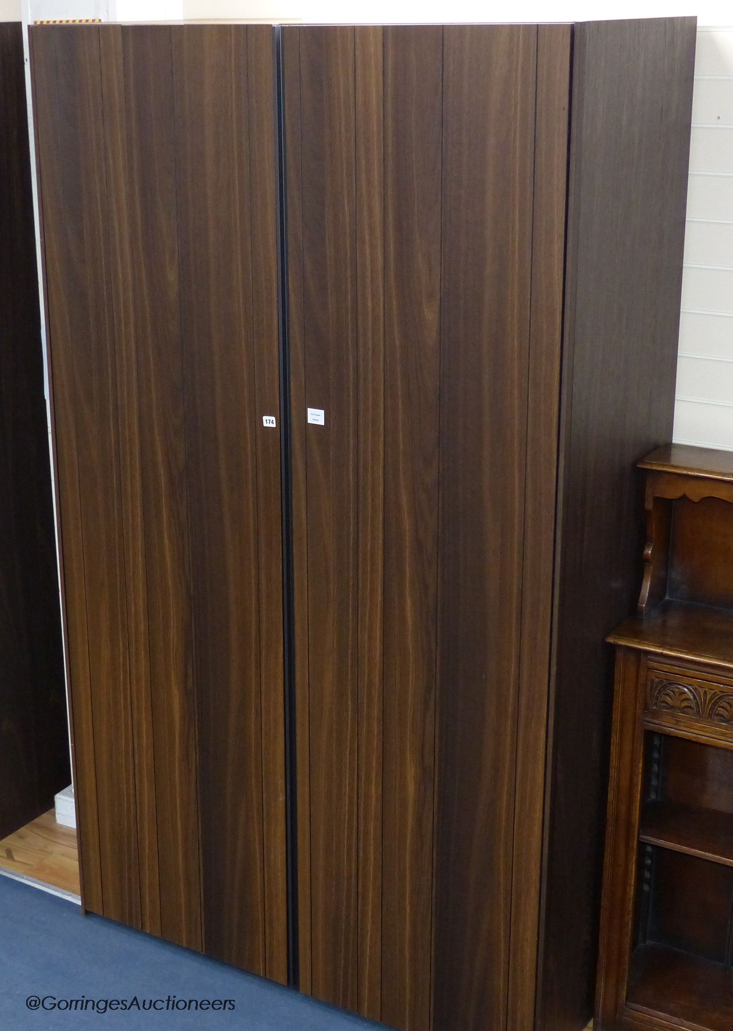 A Poliform Senzafine Stratus Spessart oak wardrobe, designed by Giuseppe Bavuso, 228 cm high, 132 cm wide, 61 cm deep